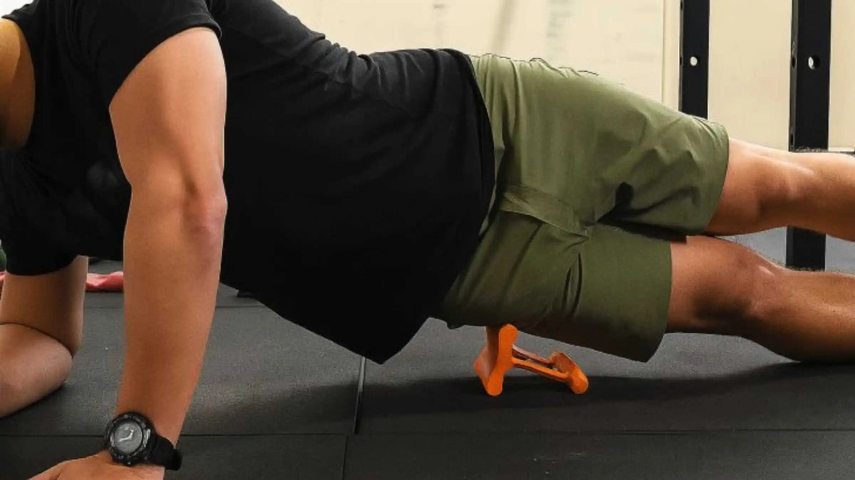 Person using the Mobilization Magic Tool for targeted muscle release
